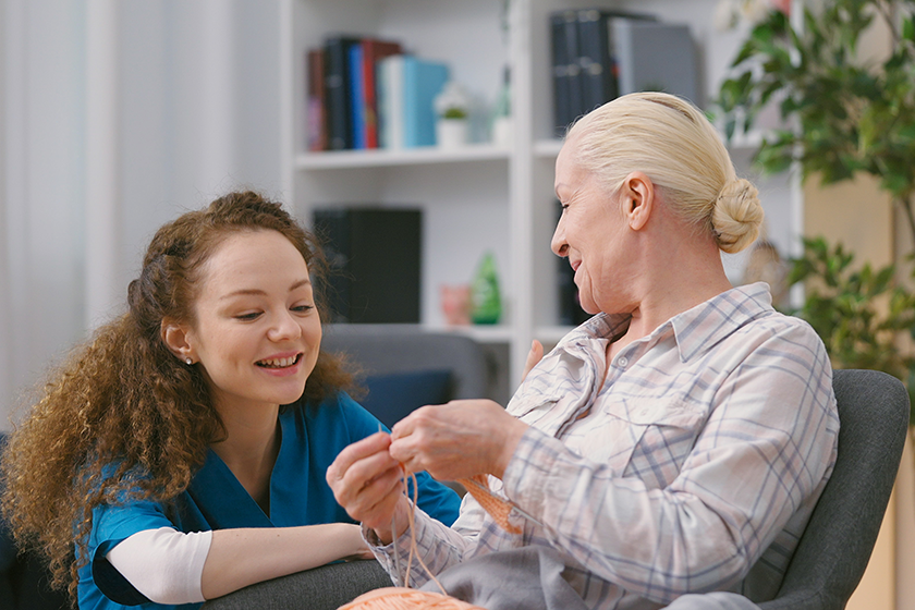 friendly-nurse-checking-senior-woman friendly-nurse-checking-senior-woman