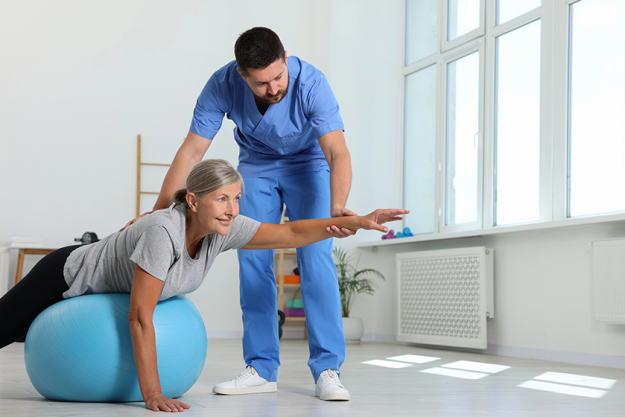 physiotherapist-working-senior-patient-rehabilitation-center physiotherapist-working-senior-patient-rehabilitation-center