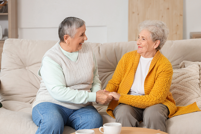senior-female-friends-holding-hands senior-female-friends-holding-hands