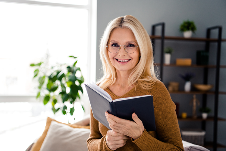 Photo of cheerful charming lady spending free time