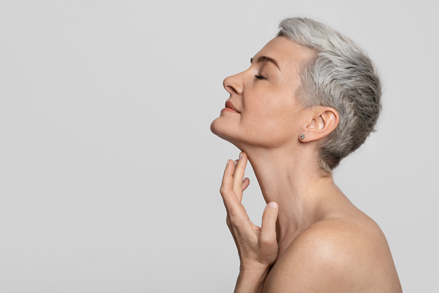 anti-age-treatment-beautiful-middle-aged-woman-touching Anti-Age Treatment. Beautiful middle-aged woman touching