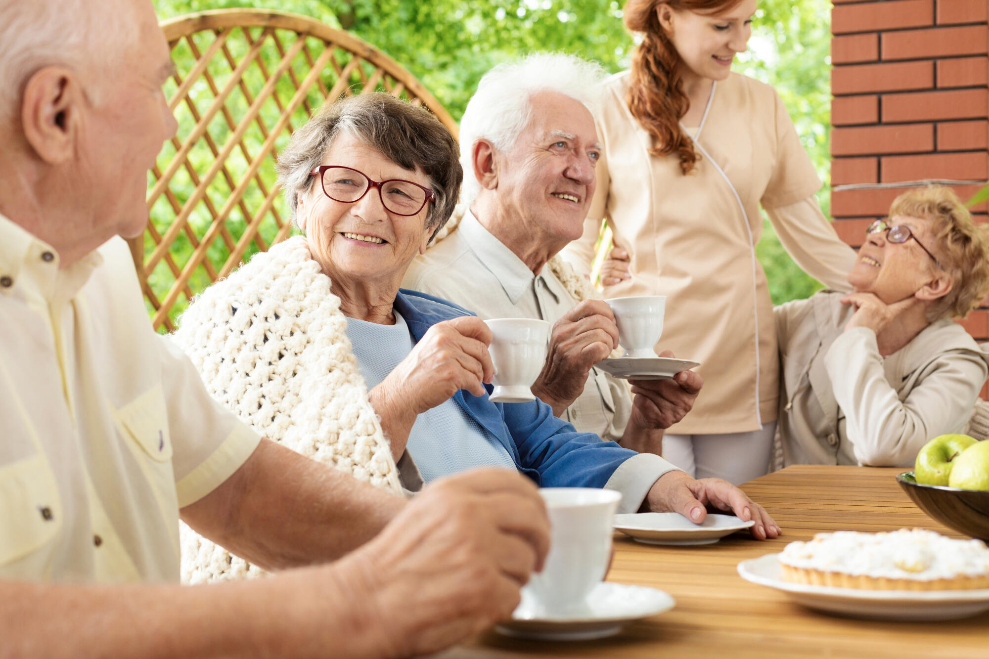 Happy,Grandmother,And,Senior,Man,During,Garden,Party