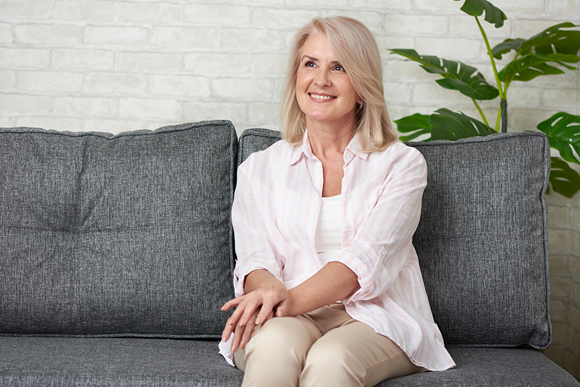 portrait-of-beautiful-old-woman-smiling Portrait of beautiful old woman smiling on a sofa