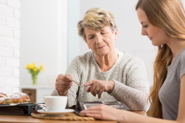Portrait,Of,An,Elderly,Lady,Having,Coffee,With,Her,Granddaughter