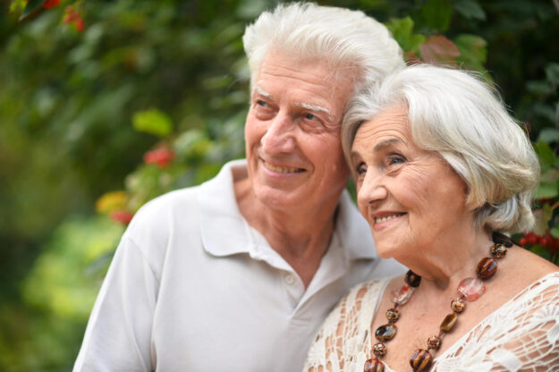 Loving mature couple in the park in summer