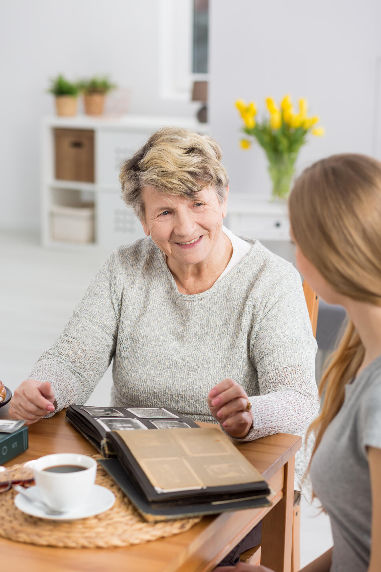 Senior,Lady,Sitting,At,A,Table,With,A,Cup,Of